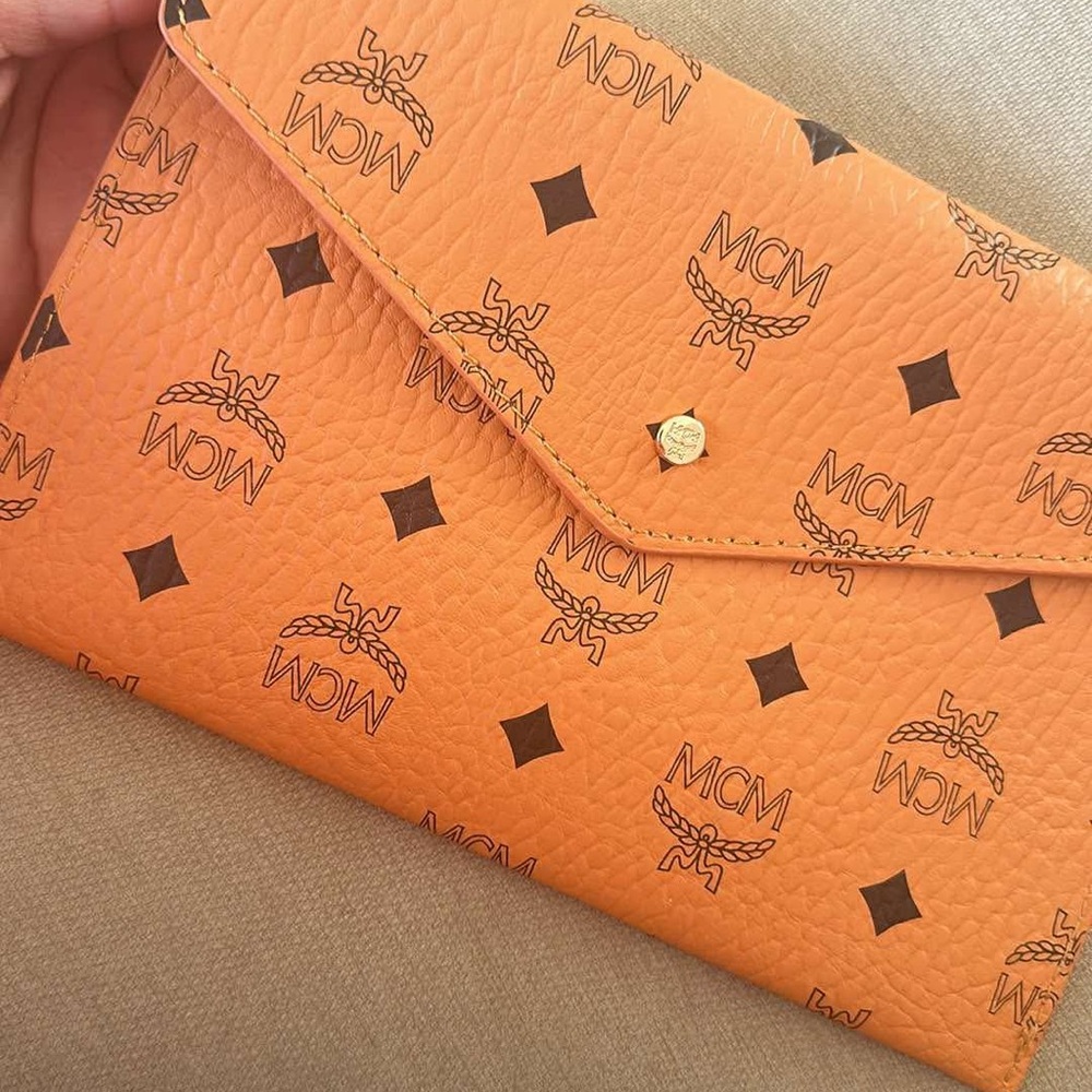 MCM Orange Clutch with Iconic Logo Print